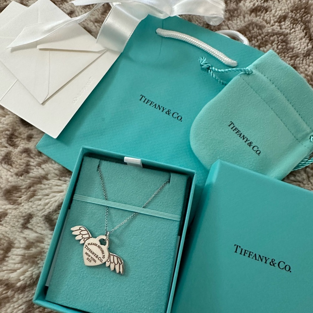 Brand new Tiffany heart with wings necklace